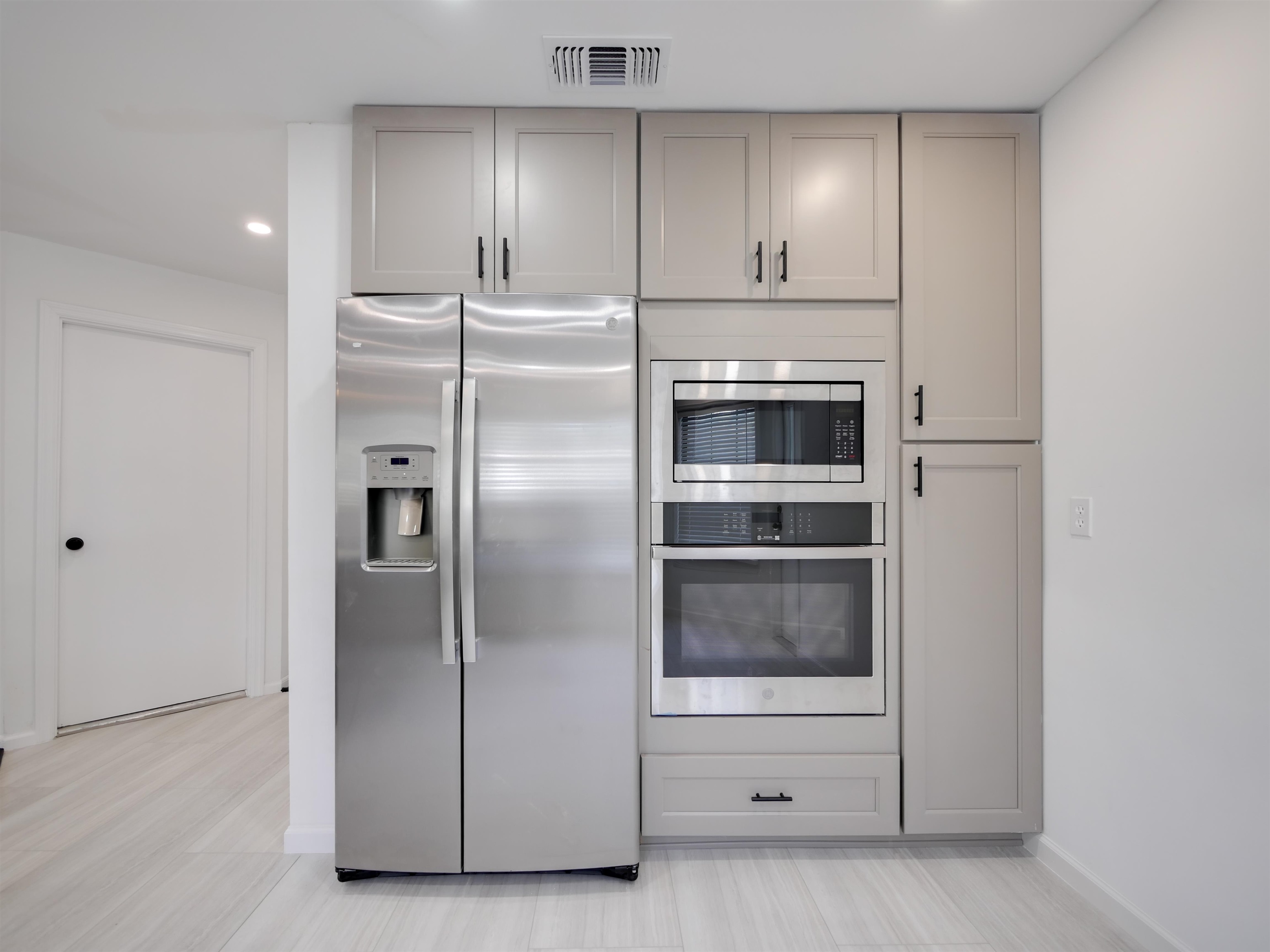 136 Bonita Road St. Augustine, FL 32086 - Photo 10 of 26 a kitchen with cabinets and stainless steel appliances