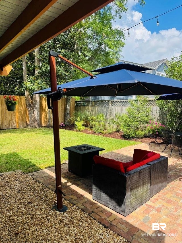 54 South Catherine Street Mobile, AL 36604 - Photo 44 of 55 Ah, this backyard is fantastic - brick patio, firepit, privacy fenced, easy care landscape.