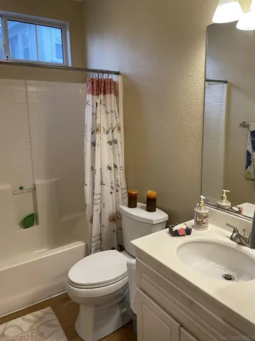 a room with window and ceiling fan