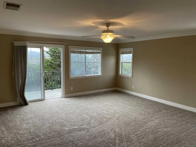 a bathroom with a sink double vanity granite and a mirror