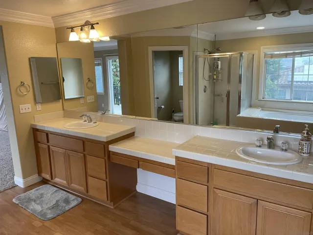 a view of living room with patio furniture and potted plants
