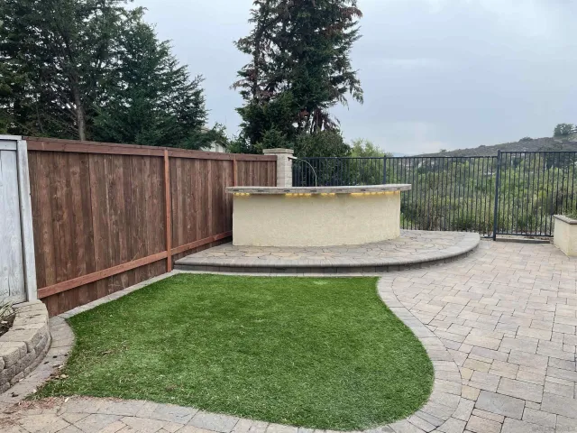 a view of a balcony with wooden fence and floor