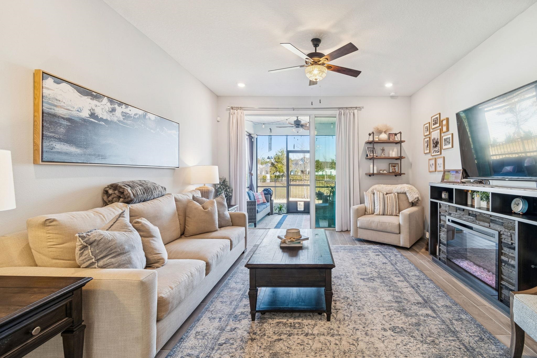262 Killarney Avenue St. Johns, FL 32259 - Photo 26 of 100 Living room with a ceiling fan, wood finished floors, a stone fireplace, and recessed lighting