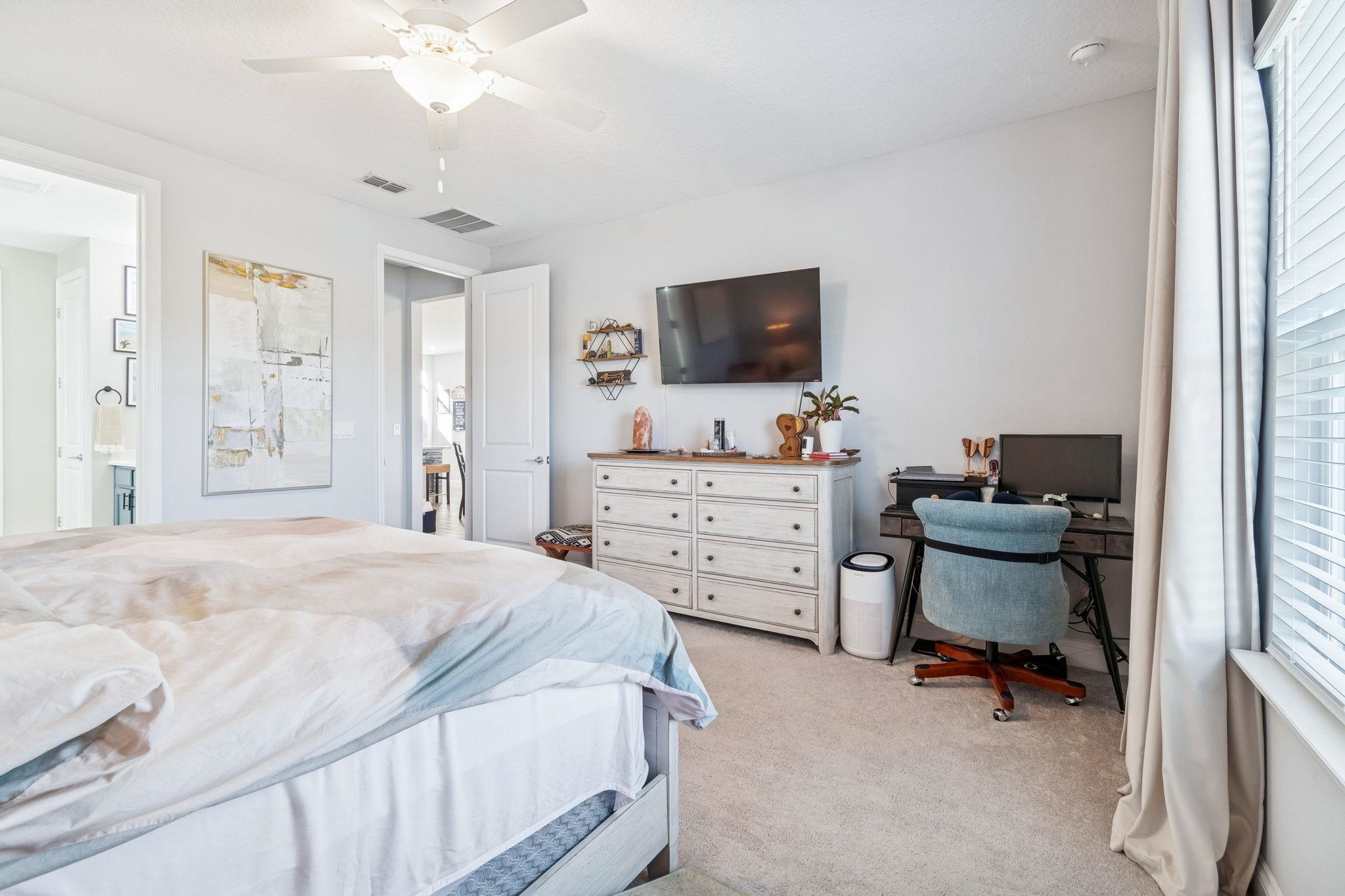 262 Killarney Avenue St. Johns, FL 32259 - Photo 34 of 100 Bedroom featuring ceiling fan, light colored carpet, and an office area