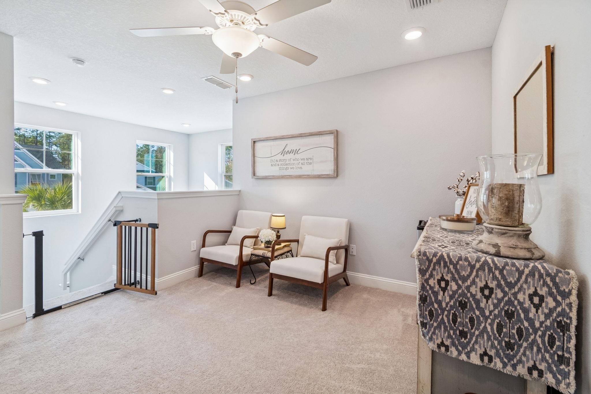 262 Killarney Avenue St. Johns, FL 32259 - Photo 44 of 100 Sitting room featuring light colored carpet, an upstairs landing, recessed lighting, and a ceiling fan