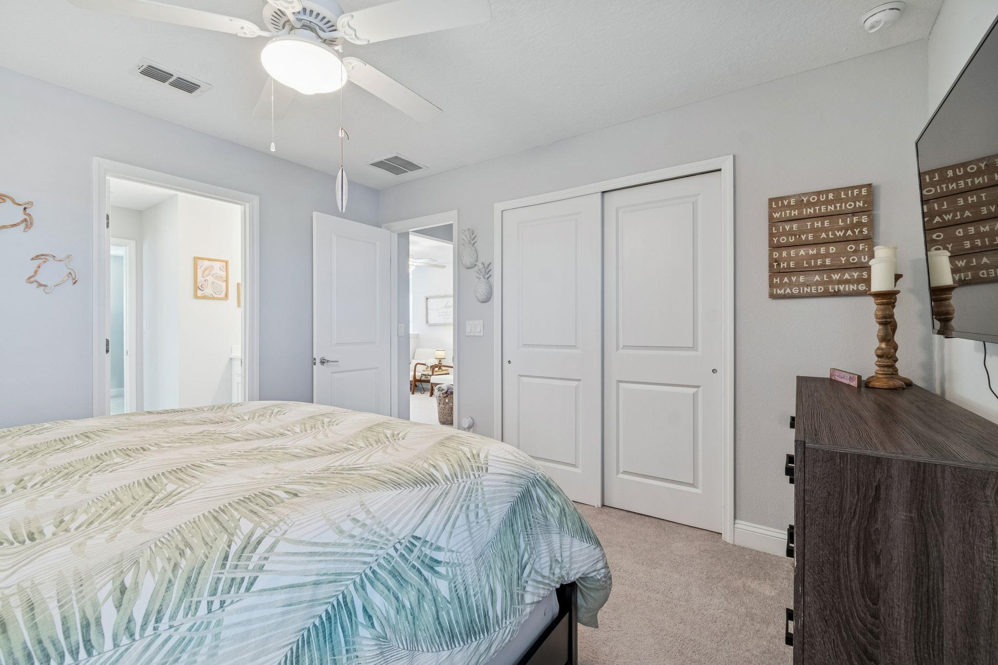 262 Killarney Avenue St. Johns, FL 32259 - Photo 50 of 100 Bedroom featuring light colored carpet, a closet, and a ceiling fan