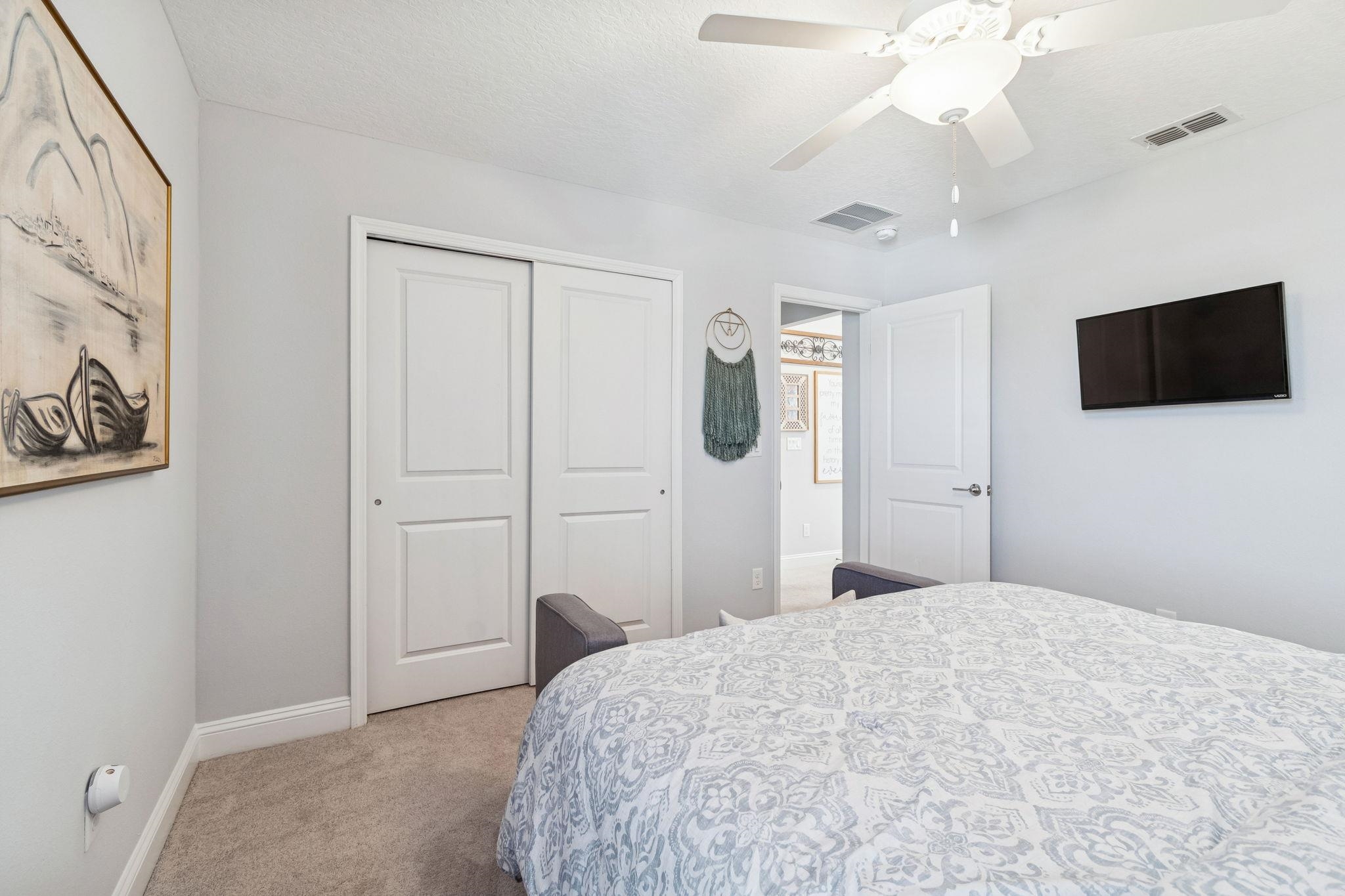 262 Killarney Avenue St. Johns, FL 32259 - Photo 59 of 100 Bedroom featuring carpet, a ceiling fan, a closet, and a textured ceiling