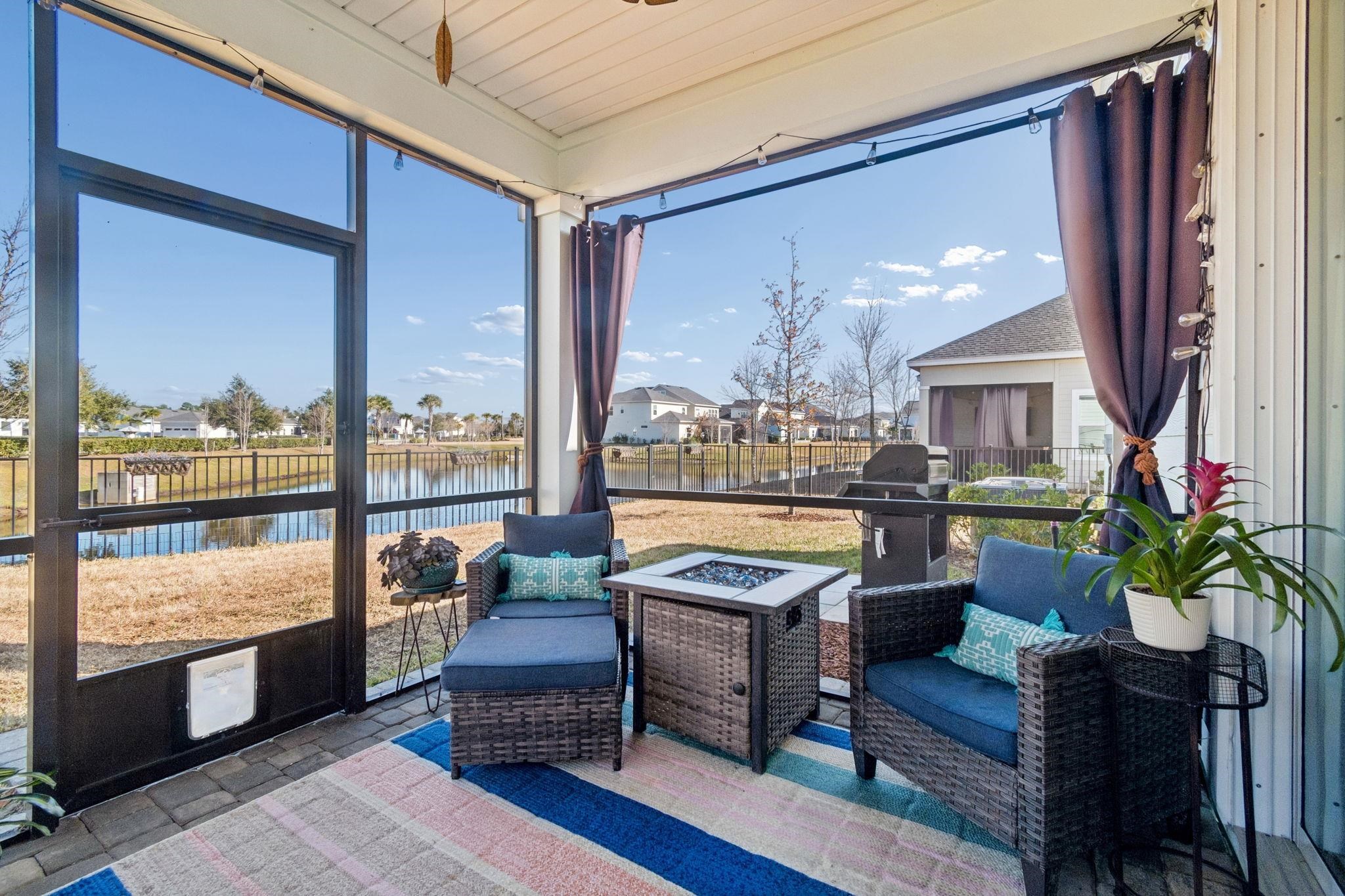 262 Killarney Avenue St. Johns, FL 32259 - Photo 63 of 100 Sunroom with a residential view, a fire pit, and a water view