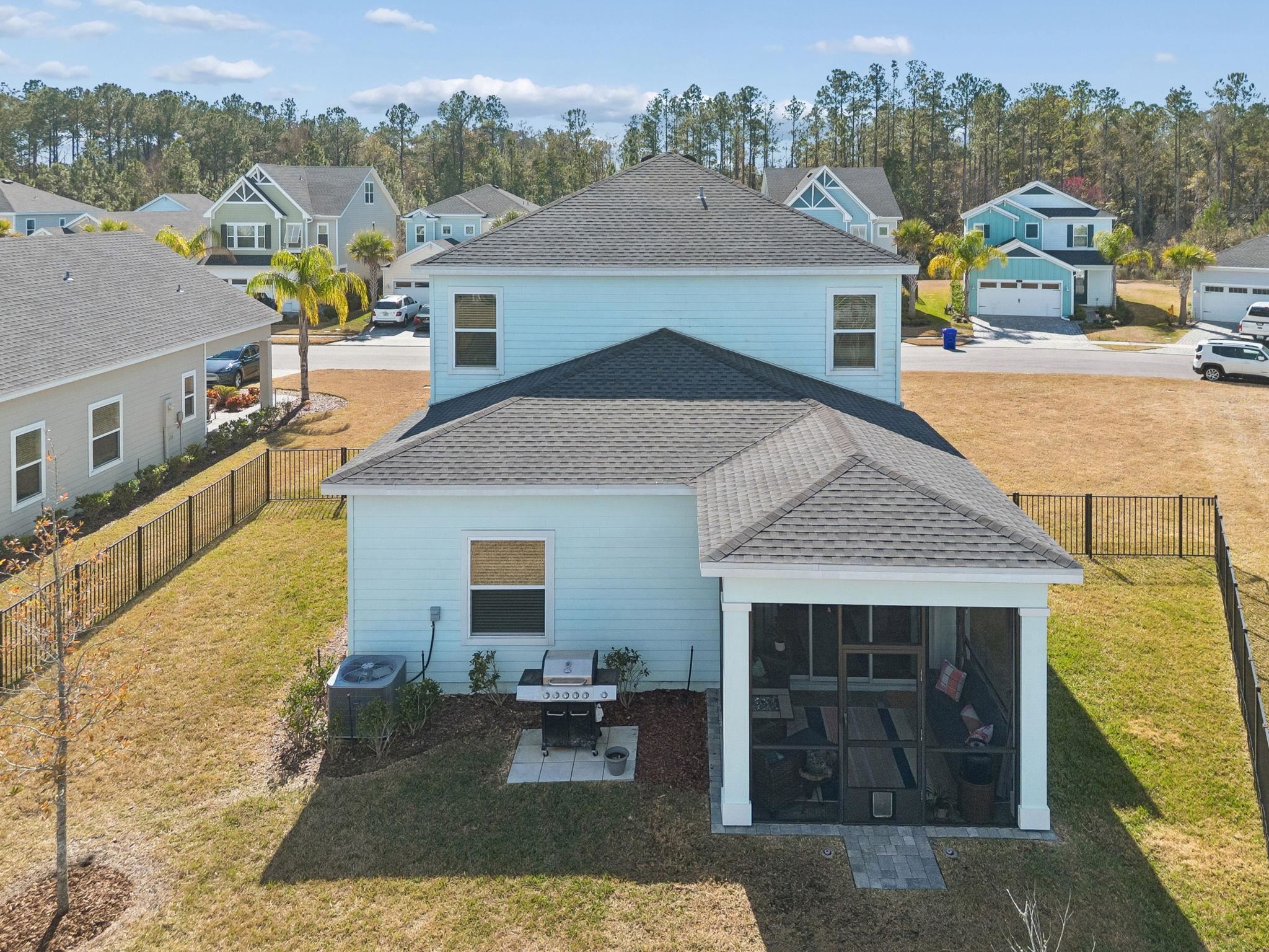 262 Killarney Avenue St. Johns, FL 32259 - Photo 76 of 100 Rear view of property featuring a residential view, a shingled roof, and a fenced backyard