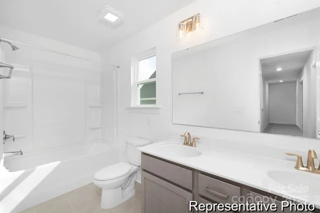 a bathroom with a sink a toilet and bathtub