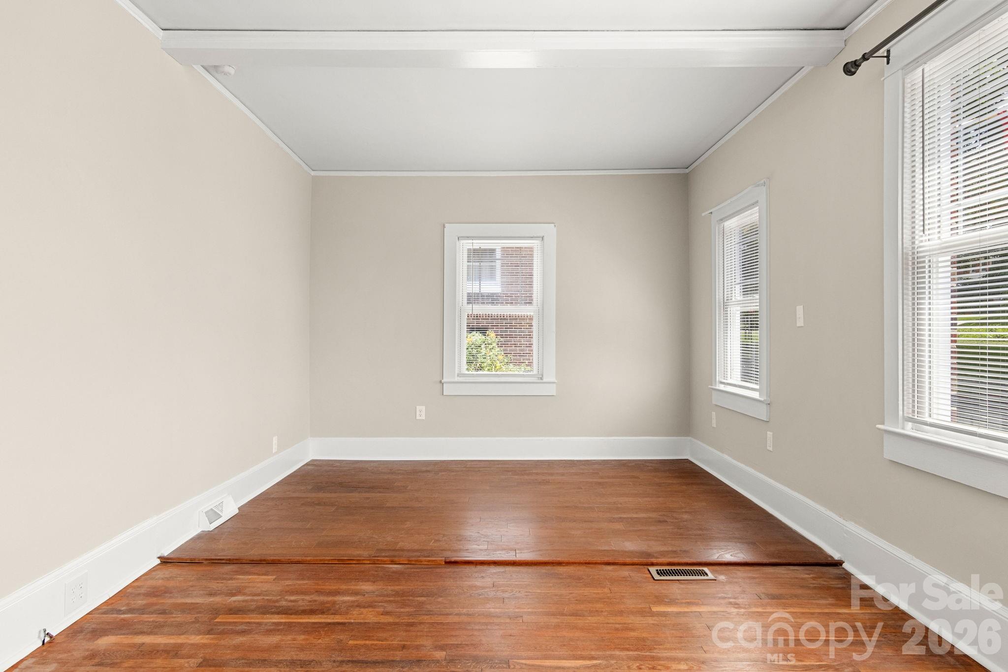 108 Reedy Street Chester, SC 29706 - Photo 30 of 42 a view of empty room with wooden floor and fan