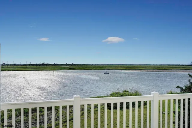 a bedroom with a bed and a night stand