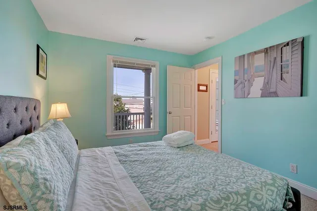 a view of a lake with houses in the back