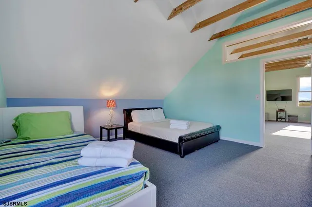 a view of a chair and table in the garden