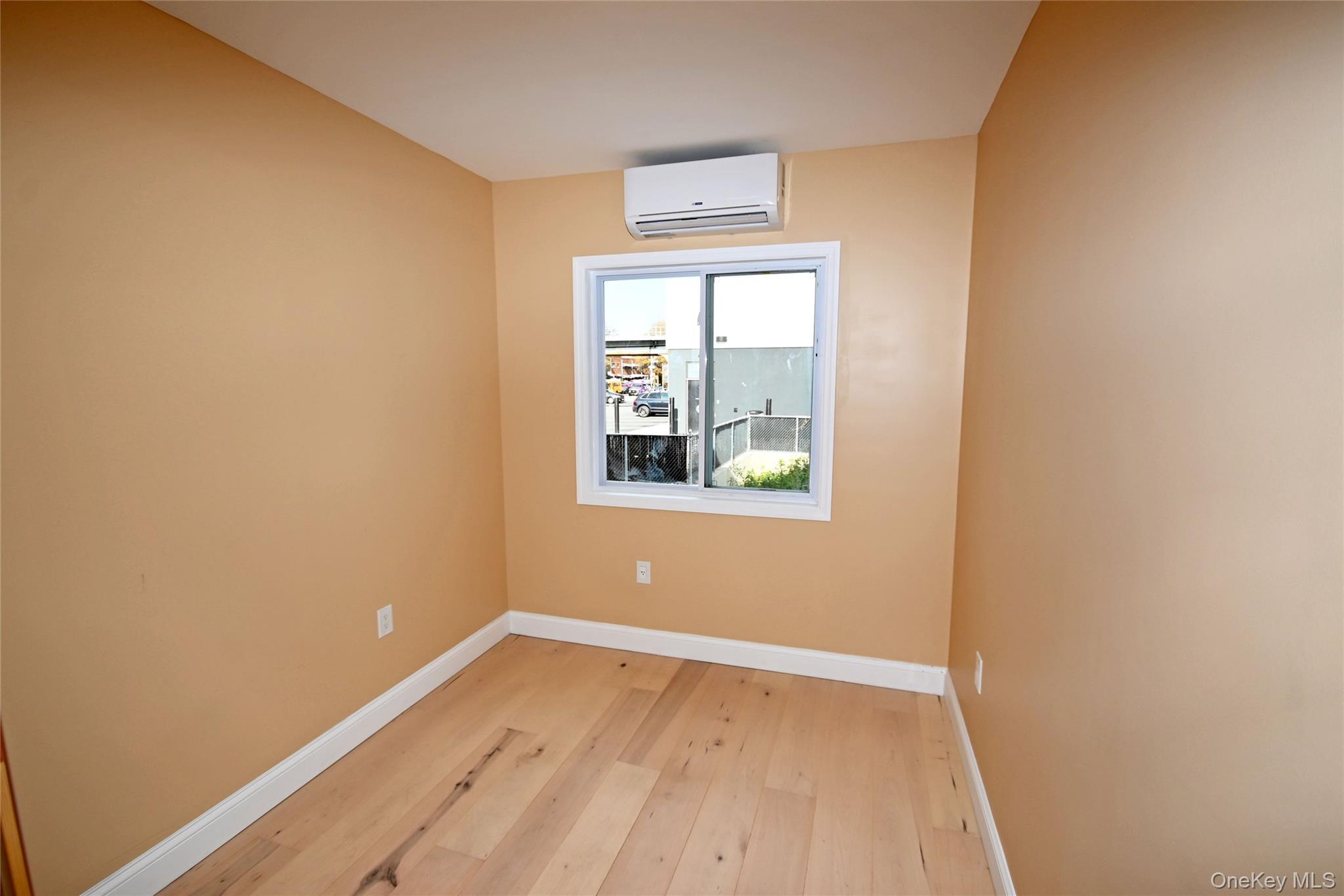 1737 Pacific Street Brooklyn, NY 11213 - Photo 15 of 38 a view of an empty room with wooden floor and a window