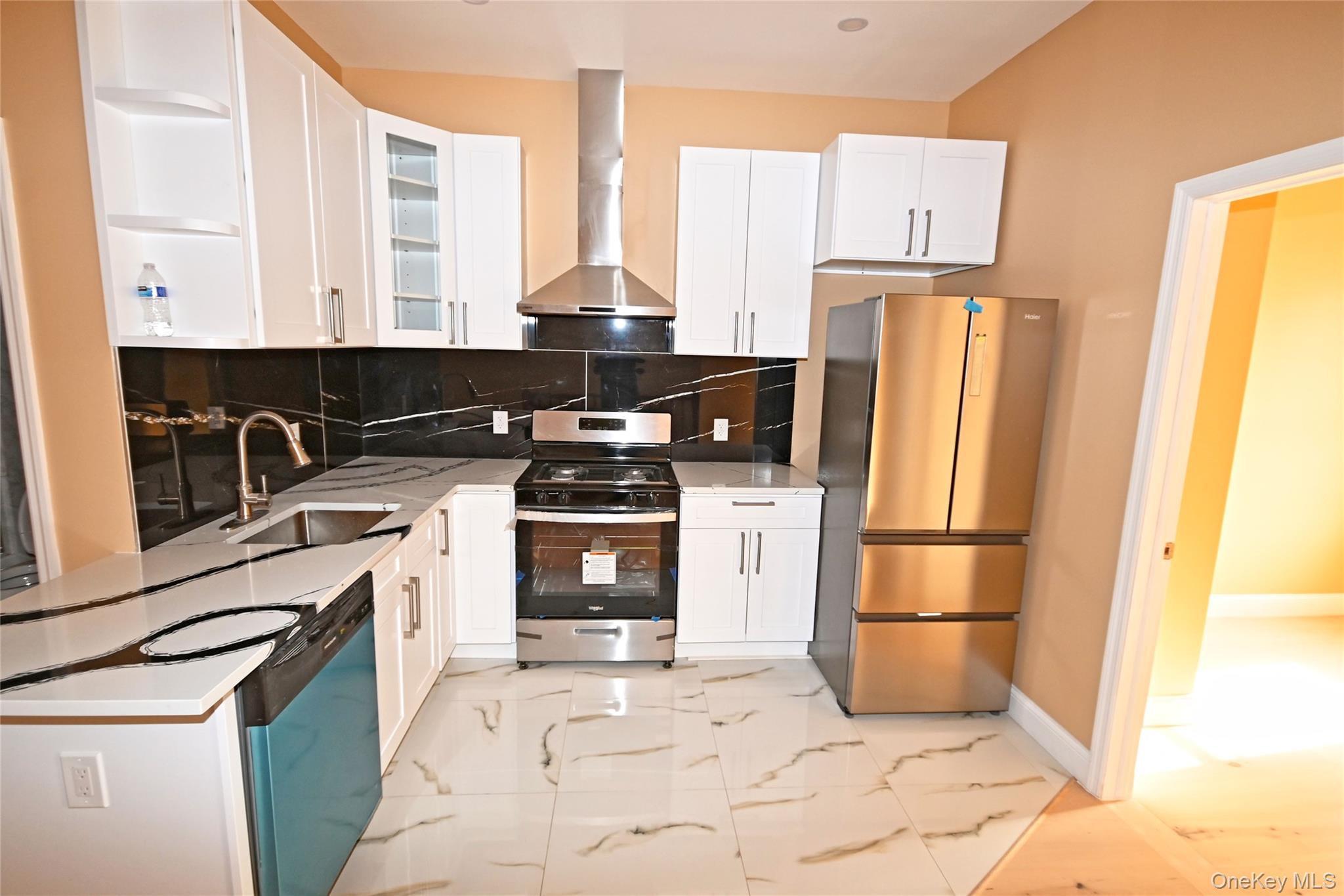 1737 Pacific Street Brooklyn, NY 11213 - Photo 25 of 38 a kitchen with stainless steel appliances a refrigerator sink and cabinets