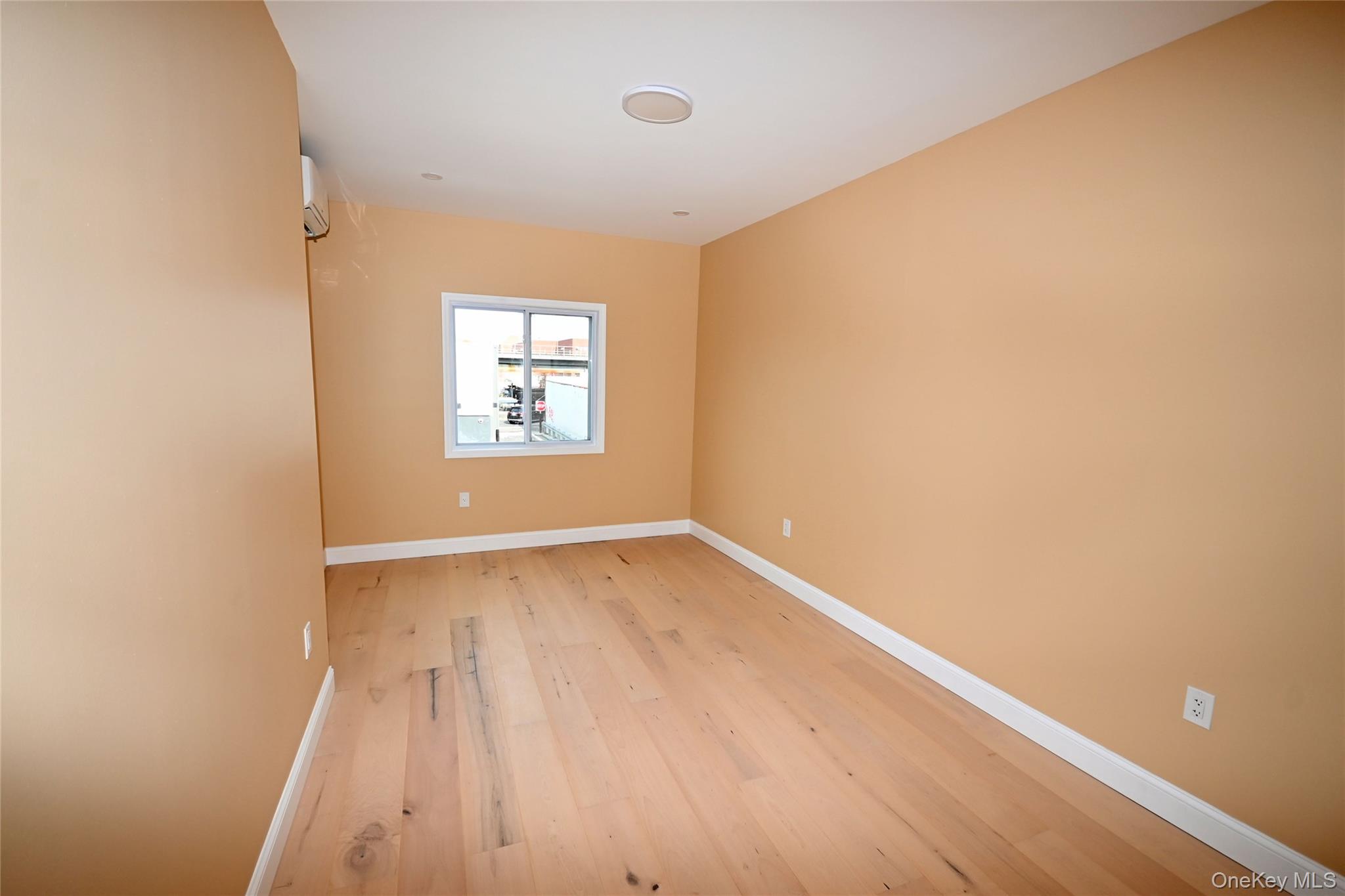 1737 Pacific Street Brooklyn, NY 11213 - Photo 26 of 38 an empty room with wooden floor and windows