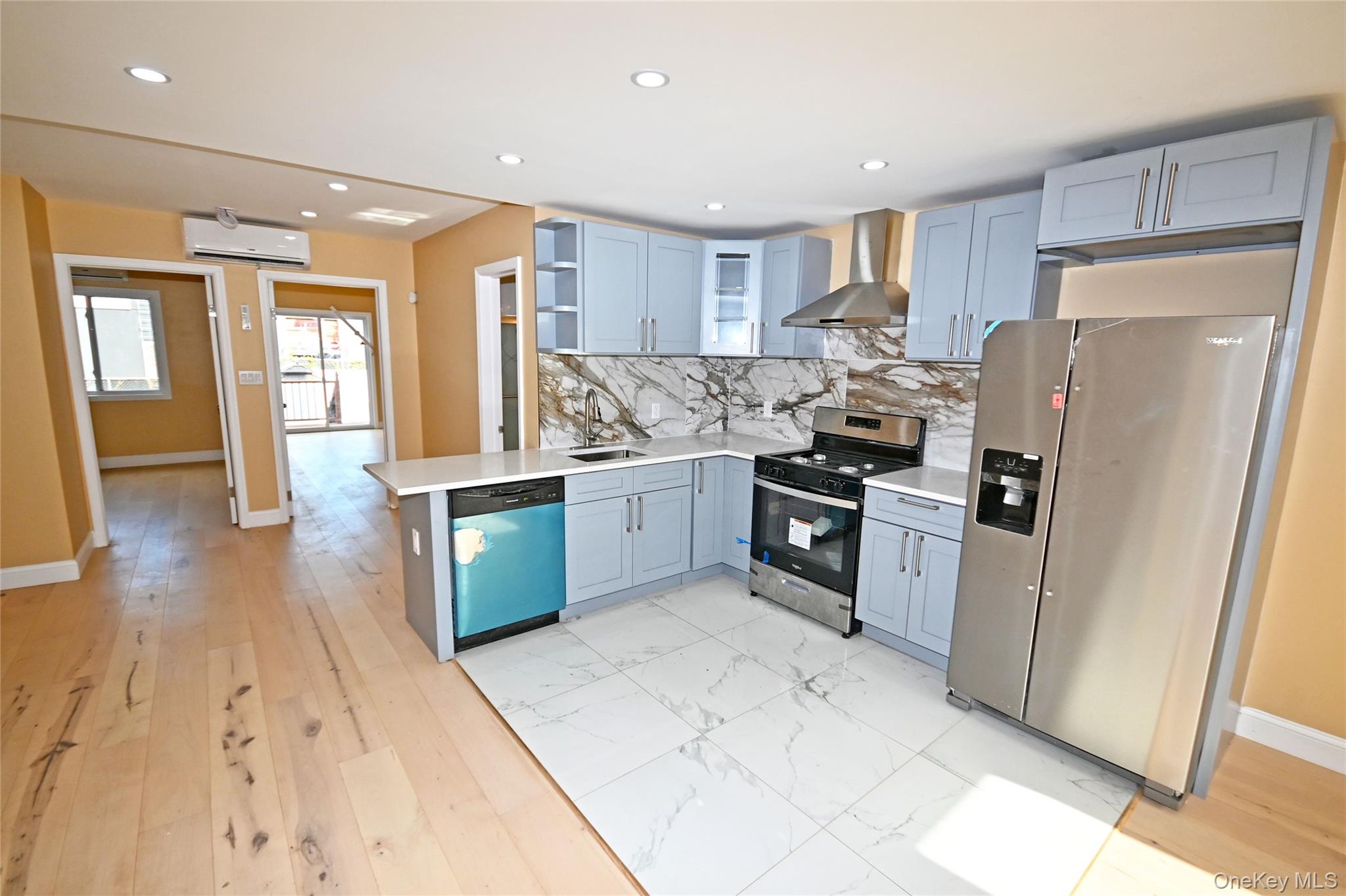 1737 Pacific Street Brooklyn, NY 11213 - Photo 7 of 38 a kitchen with stainless steel appliances a refrigerator and a stove top oven