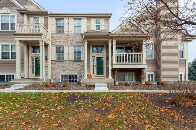 a front view of a house with yard and outdoor seating