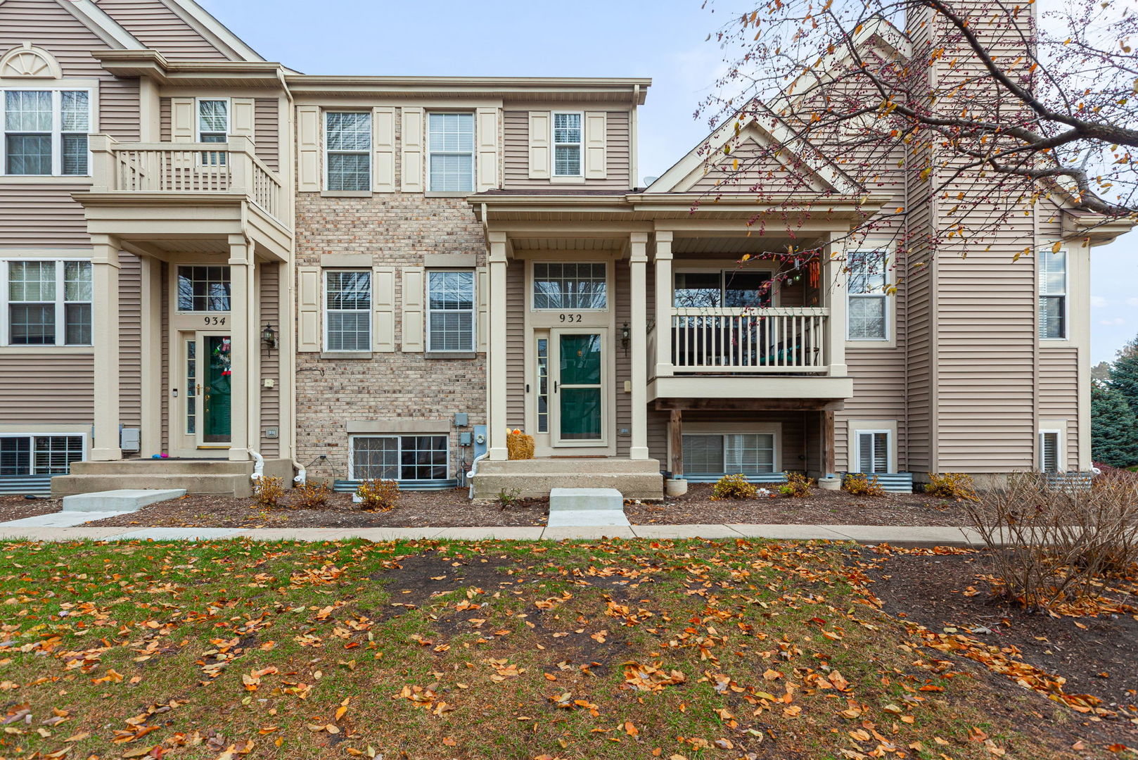 932 Clover Lane Pingree Grove, IL 60140 - Photo 1 of 19 a front view of a house with yard and outdoor seating