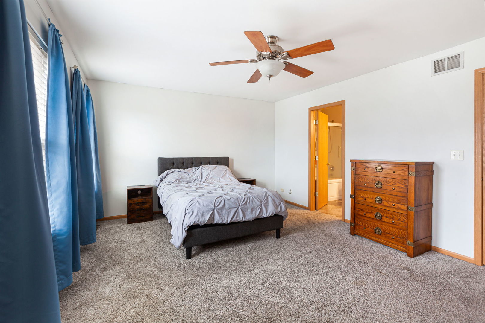 932 Clover Lane Pingree Grove, IL 60140 - Photo 11 of 19 a spacious bedroom with a bed and dresser