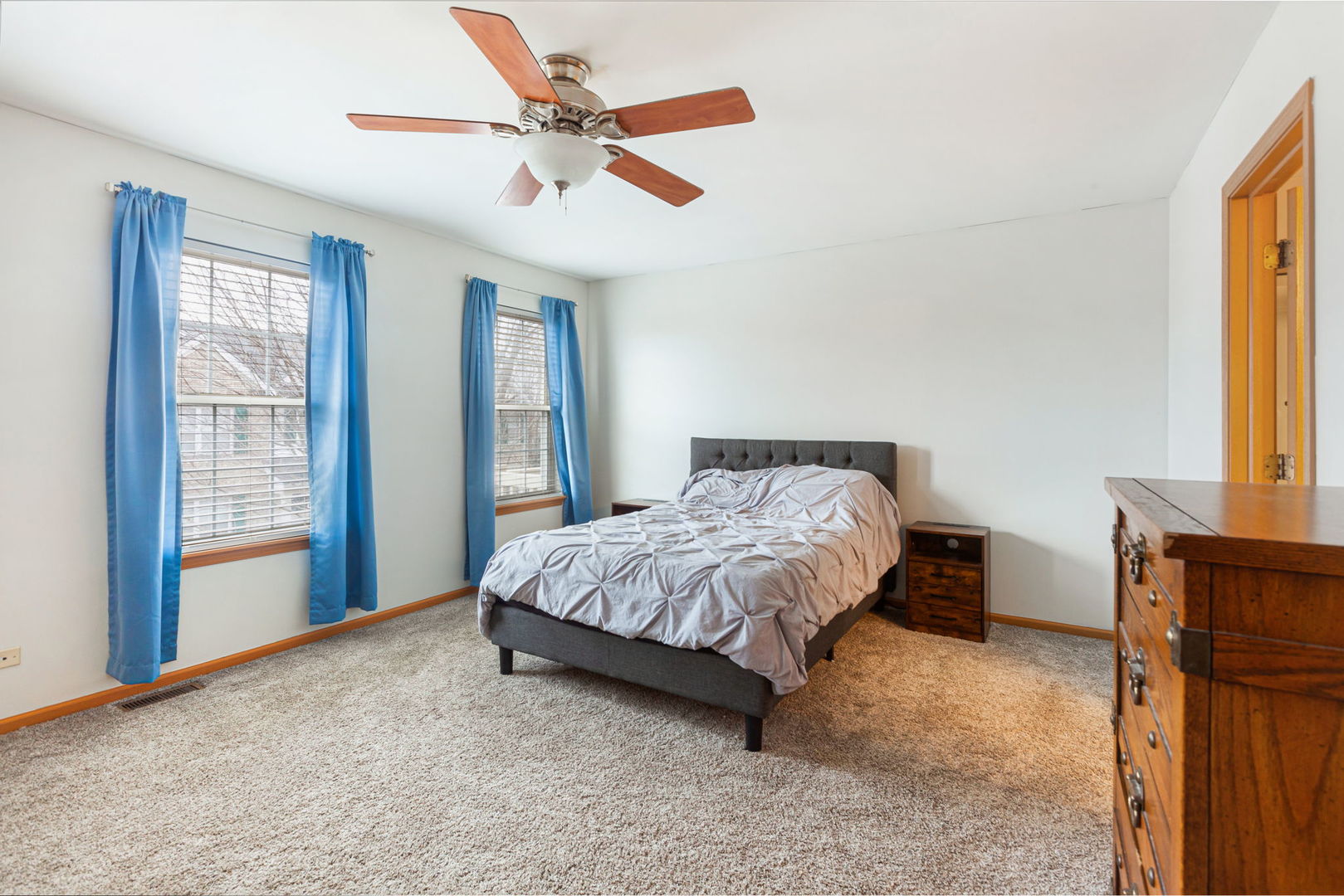 932 Clover Lane Pingree Grove, IL 60140 - Photo 13 of 19 a spacious bedroom with a bed and a large window