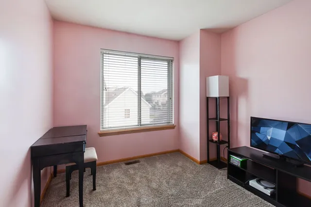 a view of a livingroom with furniture and a window