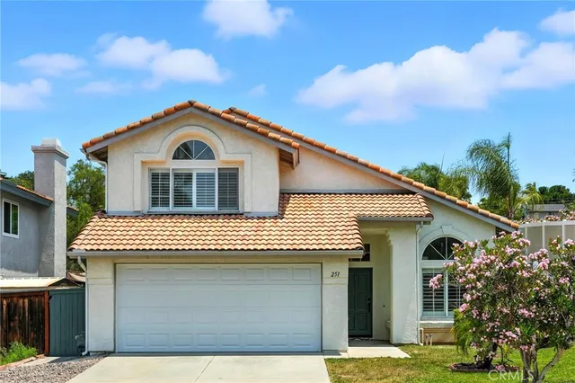 a front view of a house with a garage