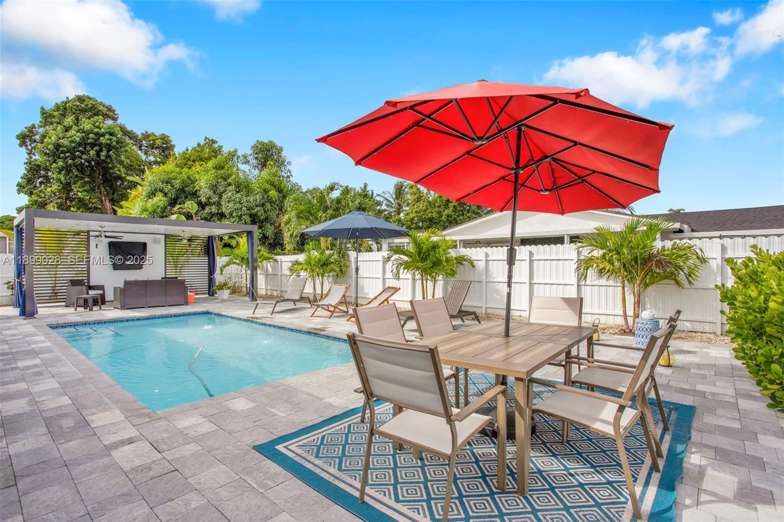16922 Southwest 107th Place Miami, FL 33157 - Photo 11 of 45 a view of a house with backyard sitting area and garden