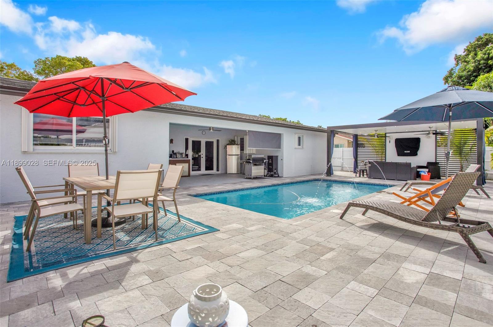 16922 Southwest 107th Place Miami, FL 33157 - Photo 12 of 45 a view of a house with swimming pool and sitting area