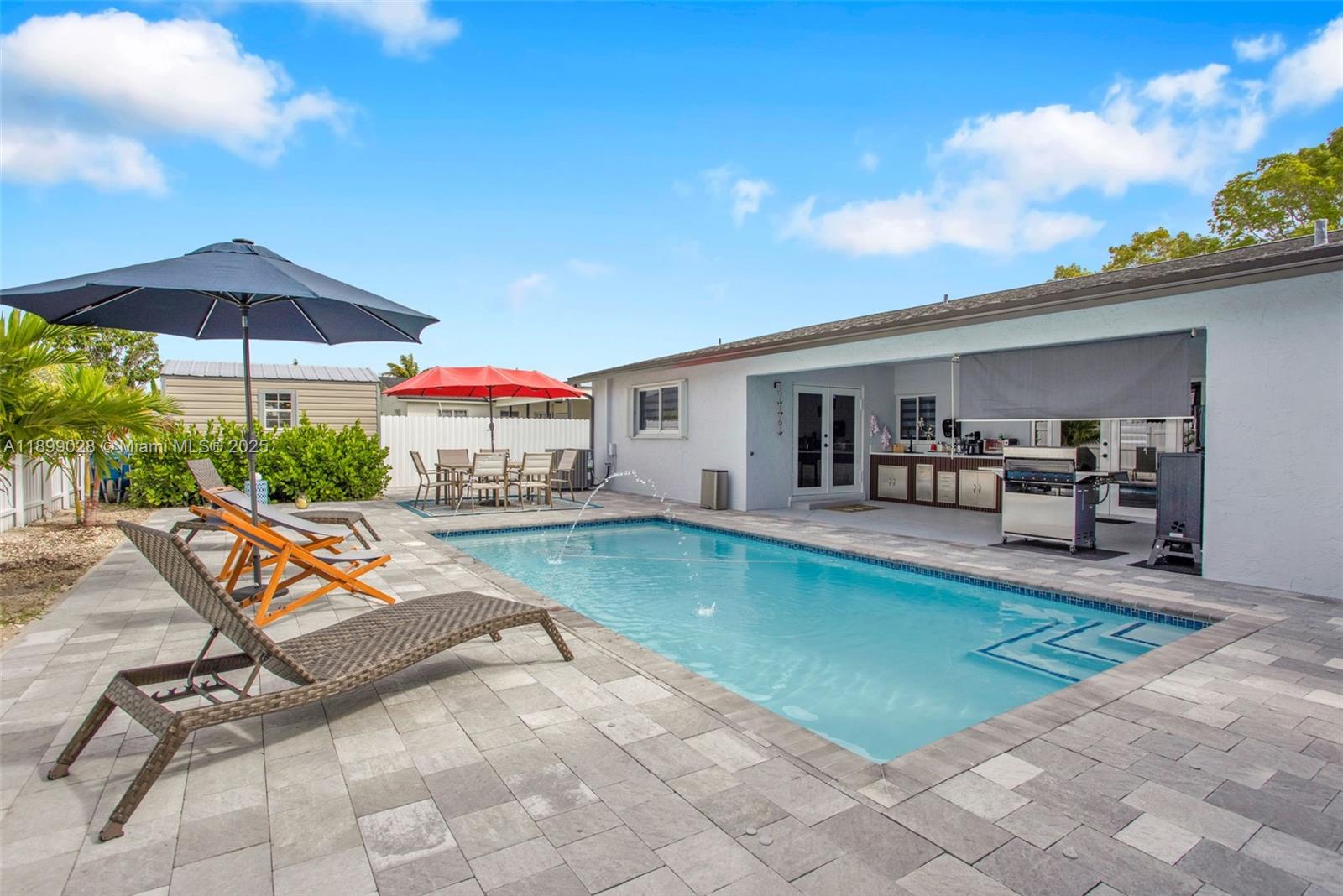 16922 Southwest 107th Place Miami, FL 33157 - Photo 13 of 45 a view of swimming pool with seating space