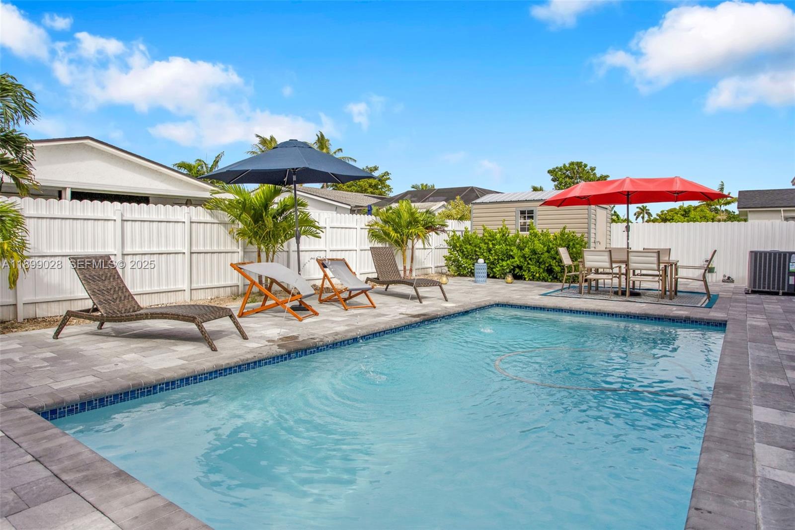 16922 Southwest 107th Place Miami, FL 33157 - Photo 16 of 45 swimming pool view with a seating space