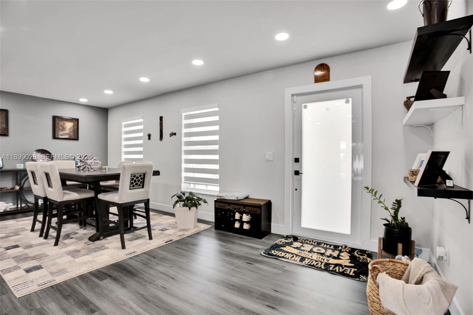 16922 Southwest 107th Place Miami, FL 33157 - Photo 17 of 45 a living room with furniture and wooden floor