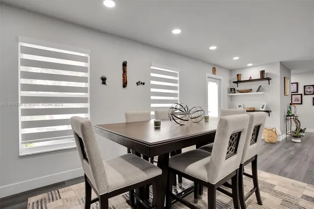 a view of a dining room with furniture and a table