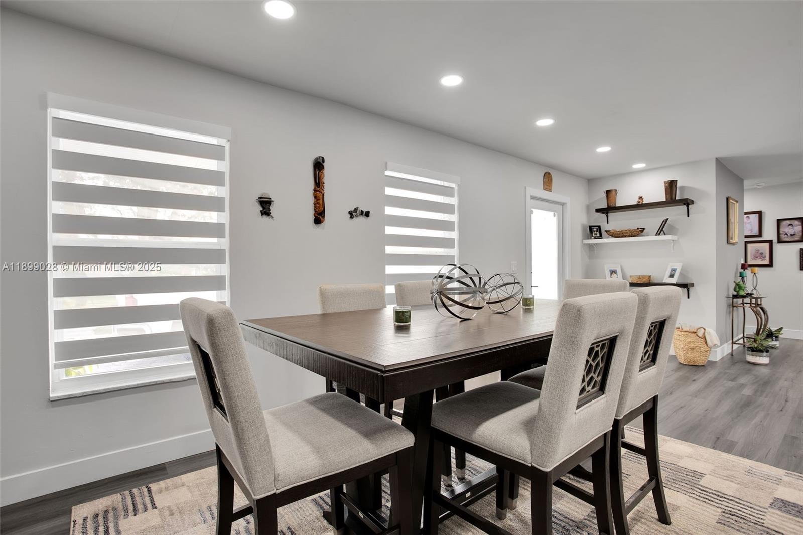 16922 Southwest 107th Place Miami, FL 33157 - Photo 20 of 45 a view of a dining room with furniture and wooden floor