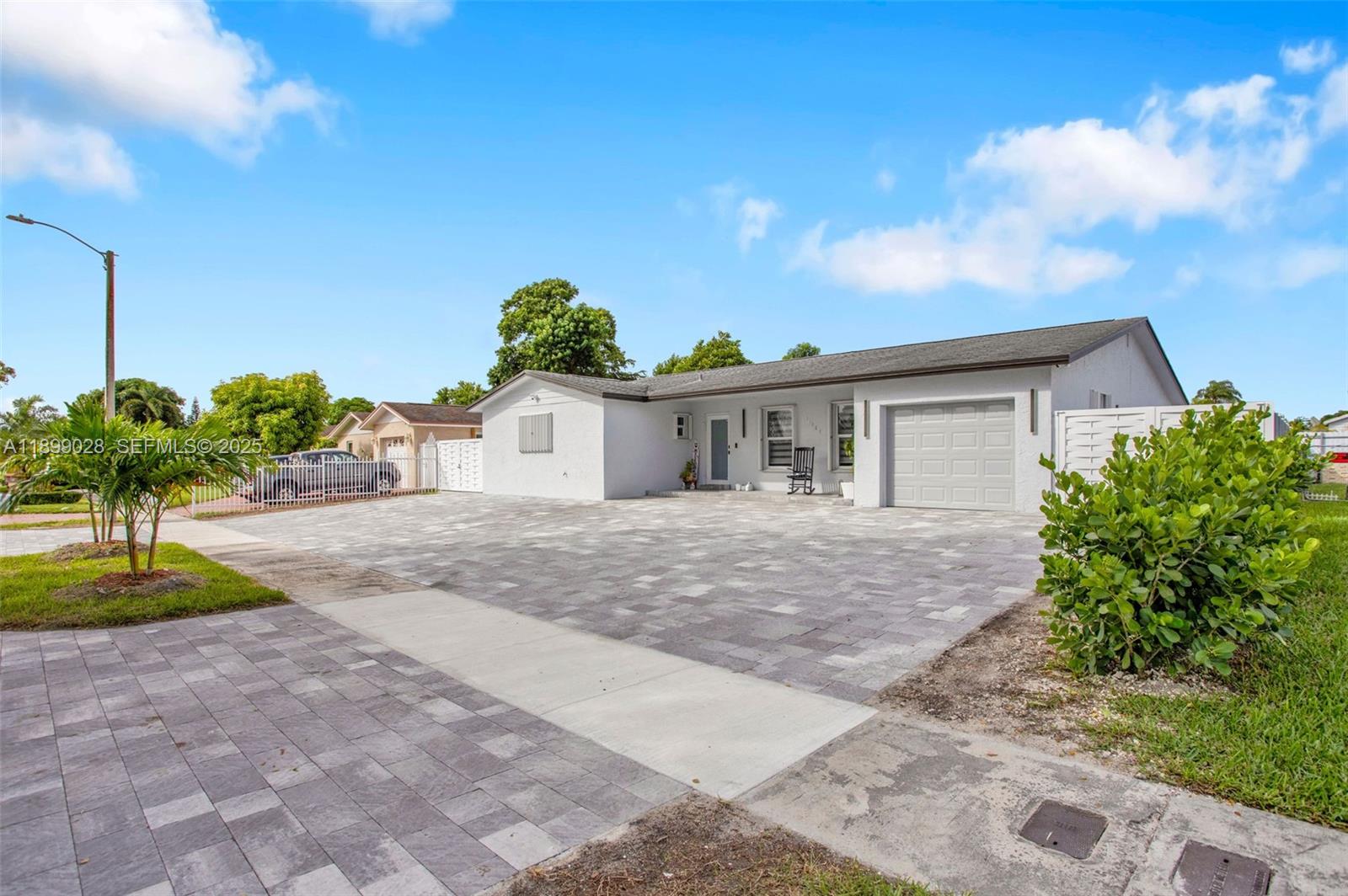 16922 Southwest 107th Place Miami, FL 33157 - Photo 2 of 45 a view of a house with backyard and garden
