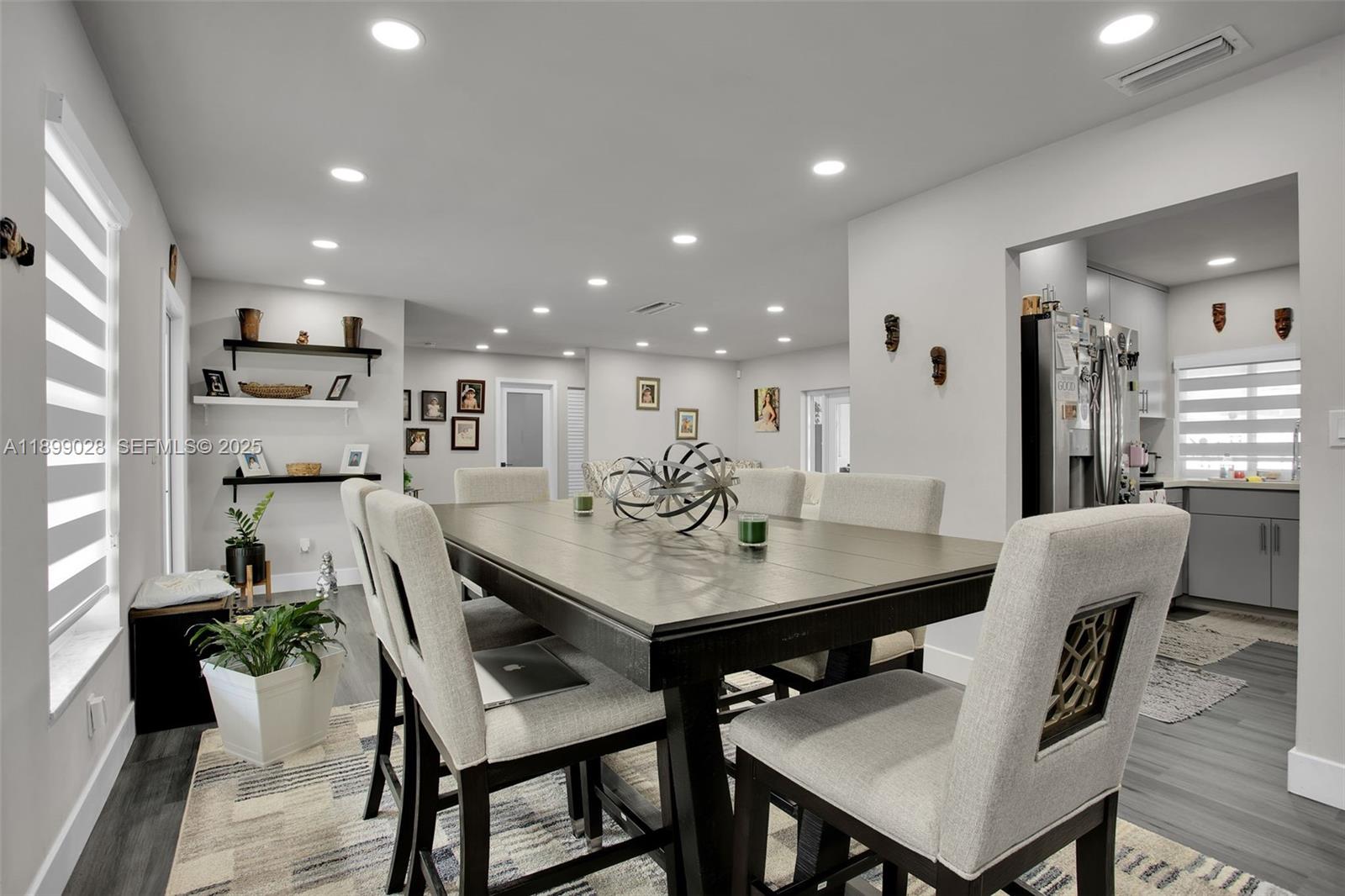 16922 Southwest 107th Place Miami, FL 33157 - Photo 21 of 45 a view of a dining room with furniture and a table
