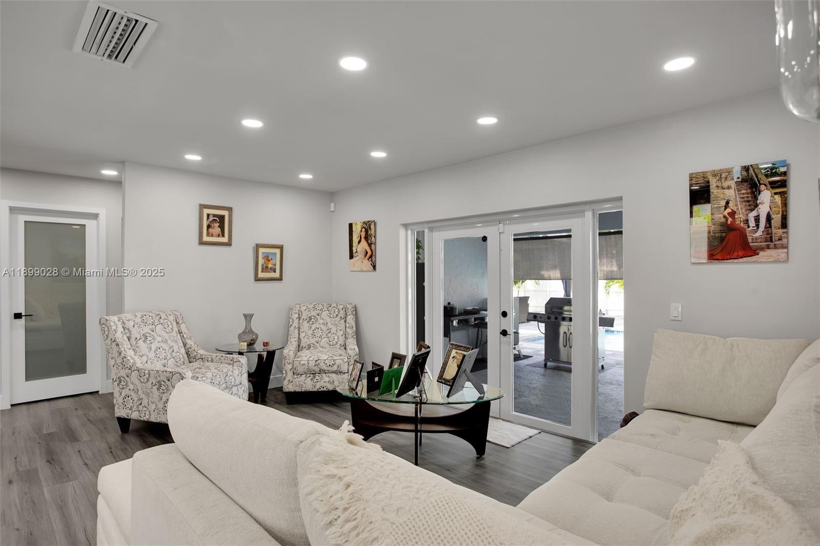 16922 Southwest 107th Place Miami, FL 33157 - Photo 26 of 45 a living room with furniture and large mirror