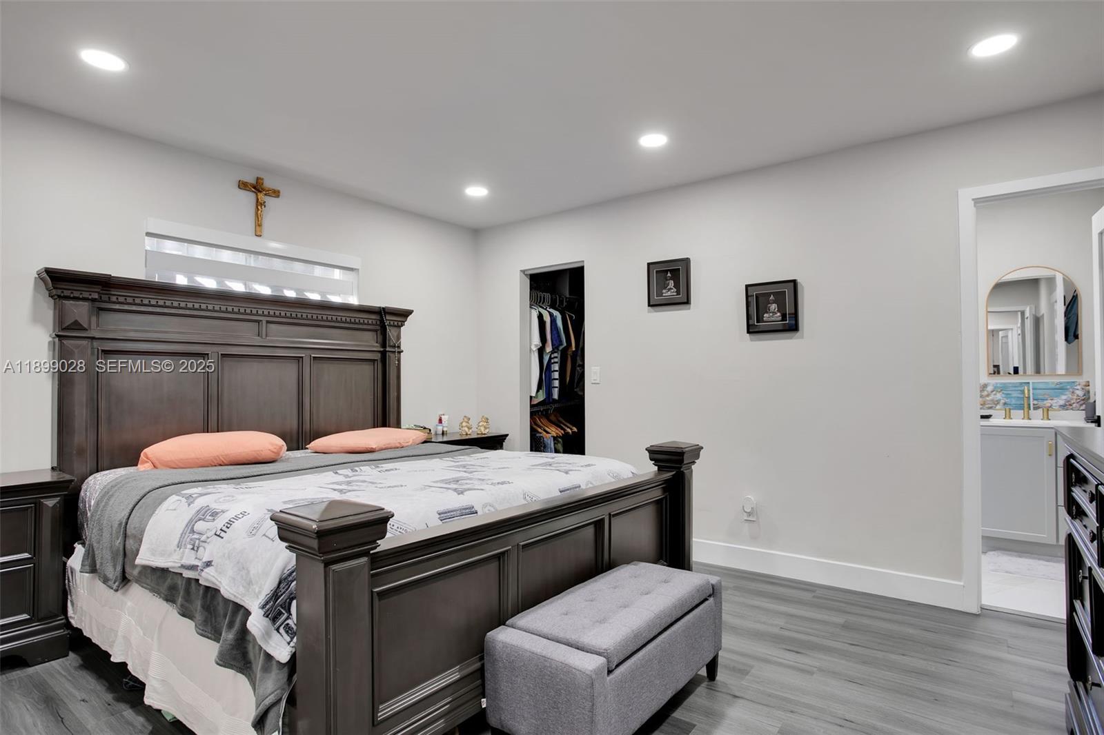 16922 Southwest 107th Place Miami, FL 33157 - Photo 27 of 45 a bed room with a bed and a television