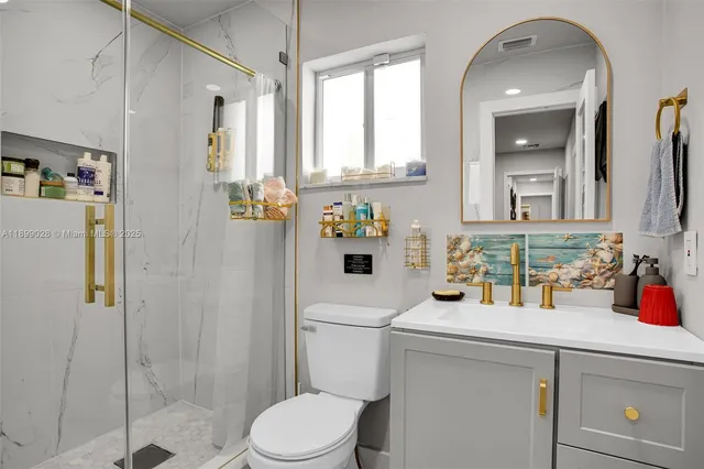 a bedroom with a bed and a table