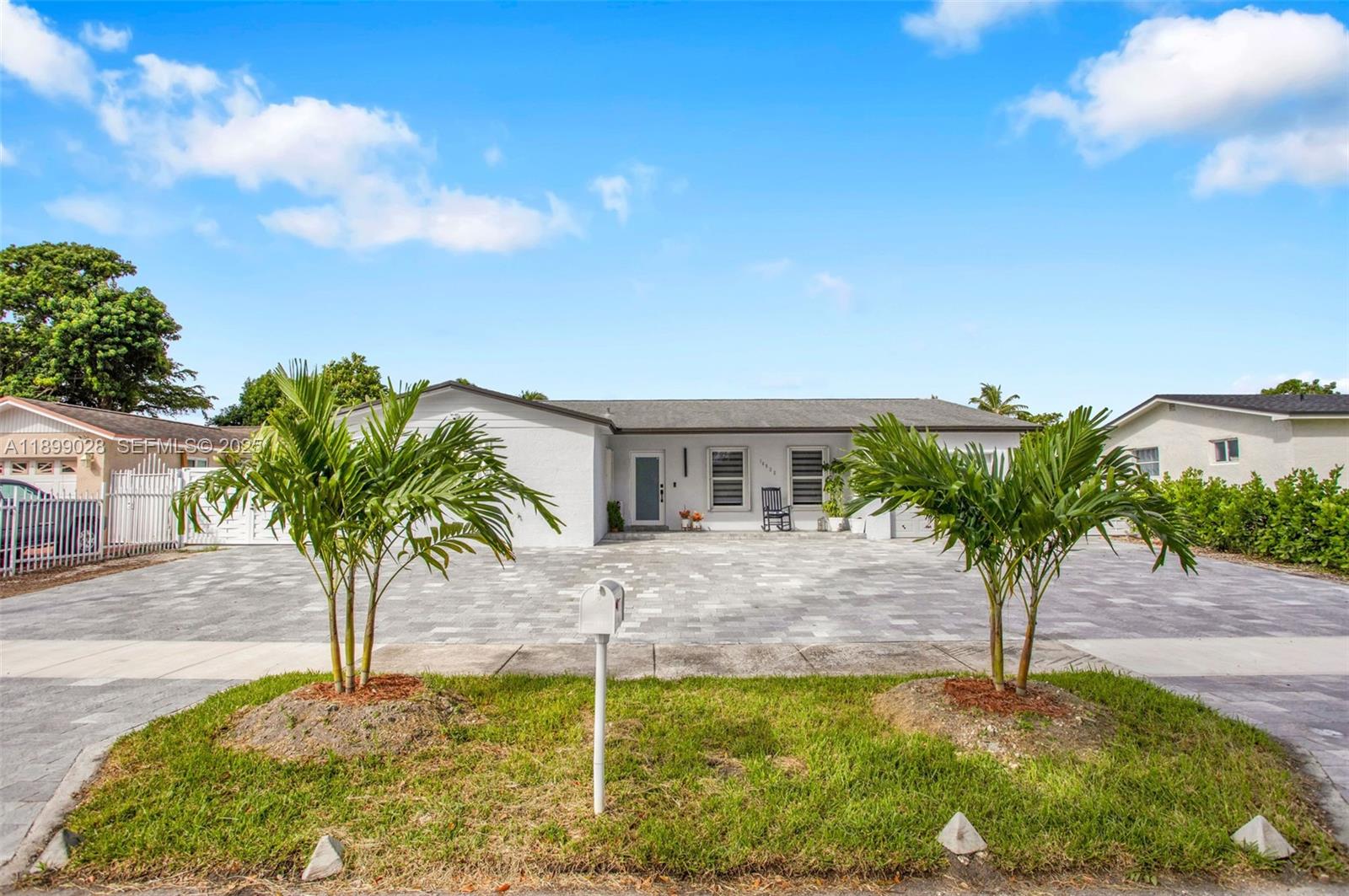 16922 Southwest 107th Place Miami, FL 33157 - Photo 3 of 45 a view of a house with entertaining space