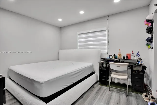 a bathroom with a sink toilet vanity and shower