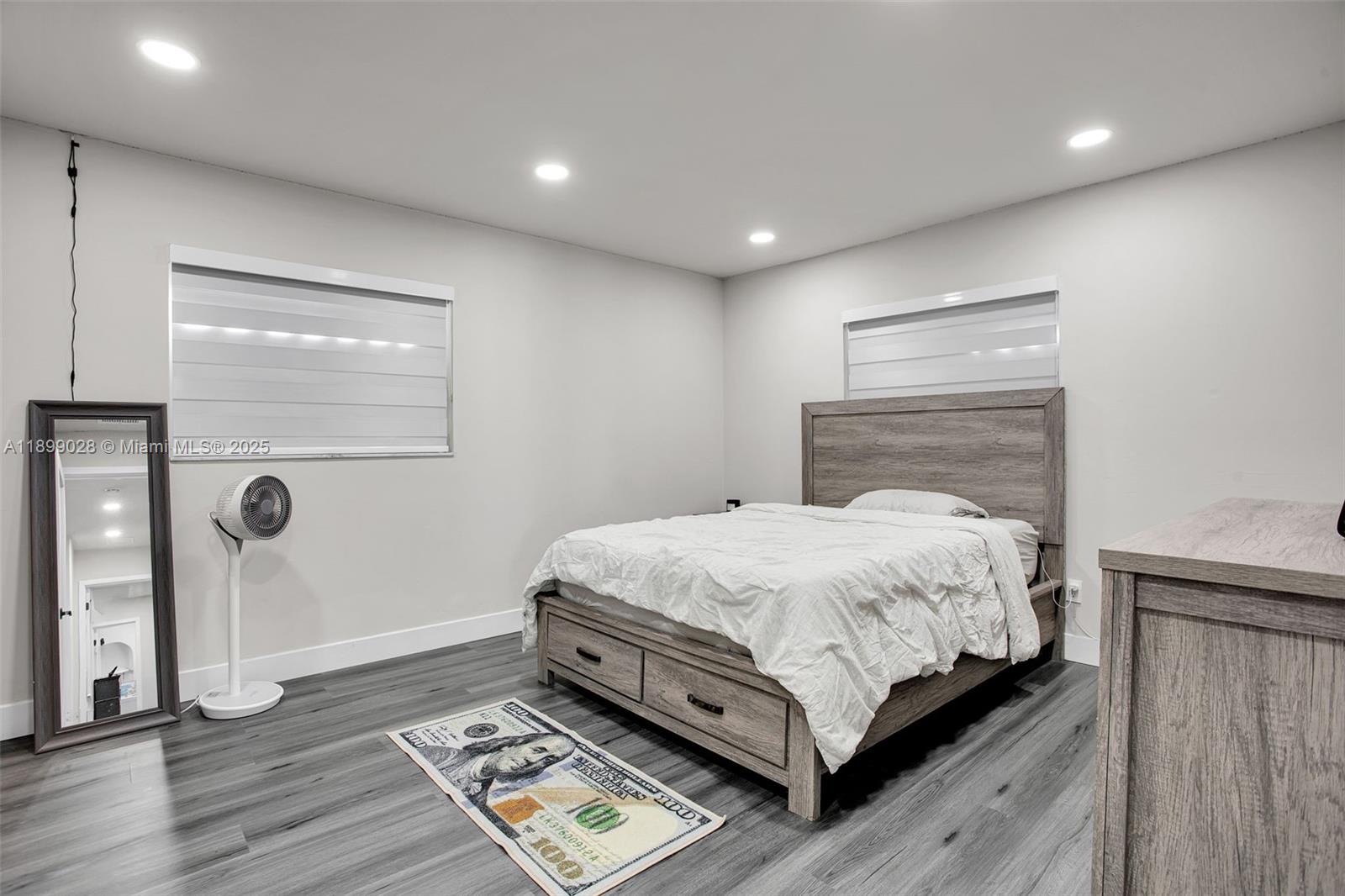 16922 Southwest 107th Place Miami, FL 33157 - Photo 34 of 45 a bedroom with a bed and window