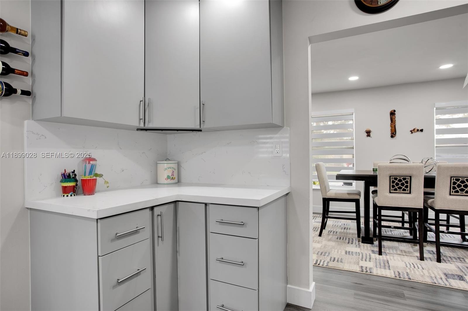 16922 Southwest 107th Place Miami, FL 33157 - Photo 39 of 45 a kitchen with a sink cabinets and wooden floor