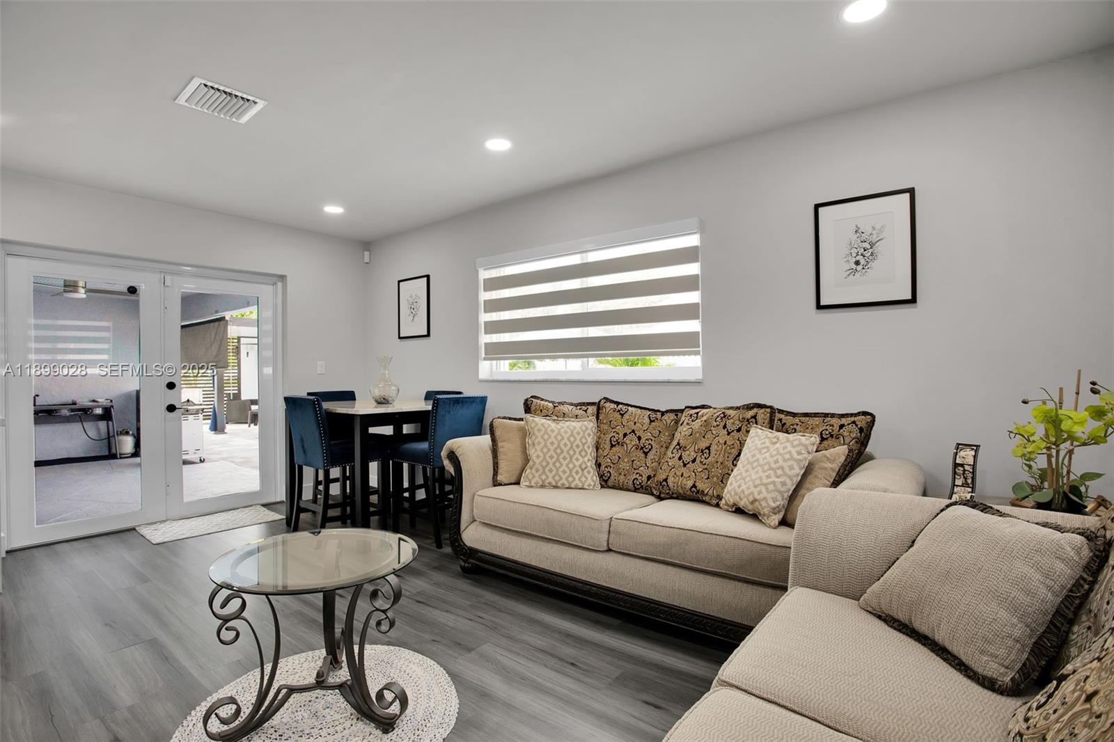 16922 Southwest 107th Place Miami, FL 33157 - Photo 41 of 45 a living room with furniture and wooden floor