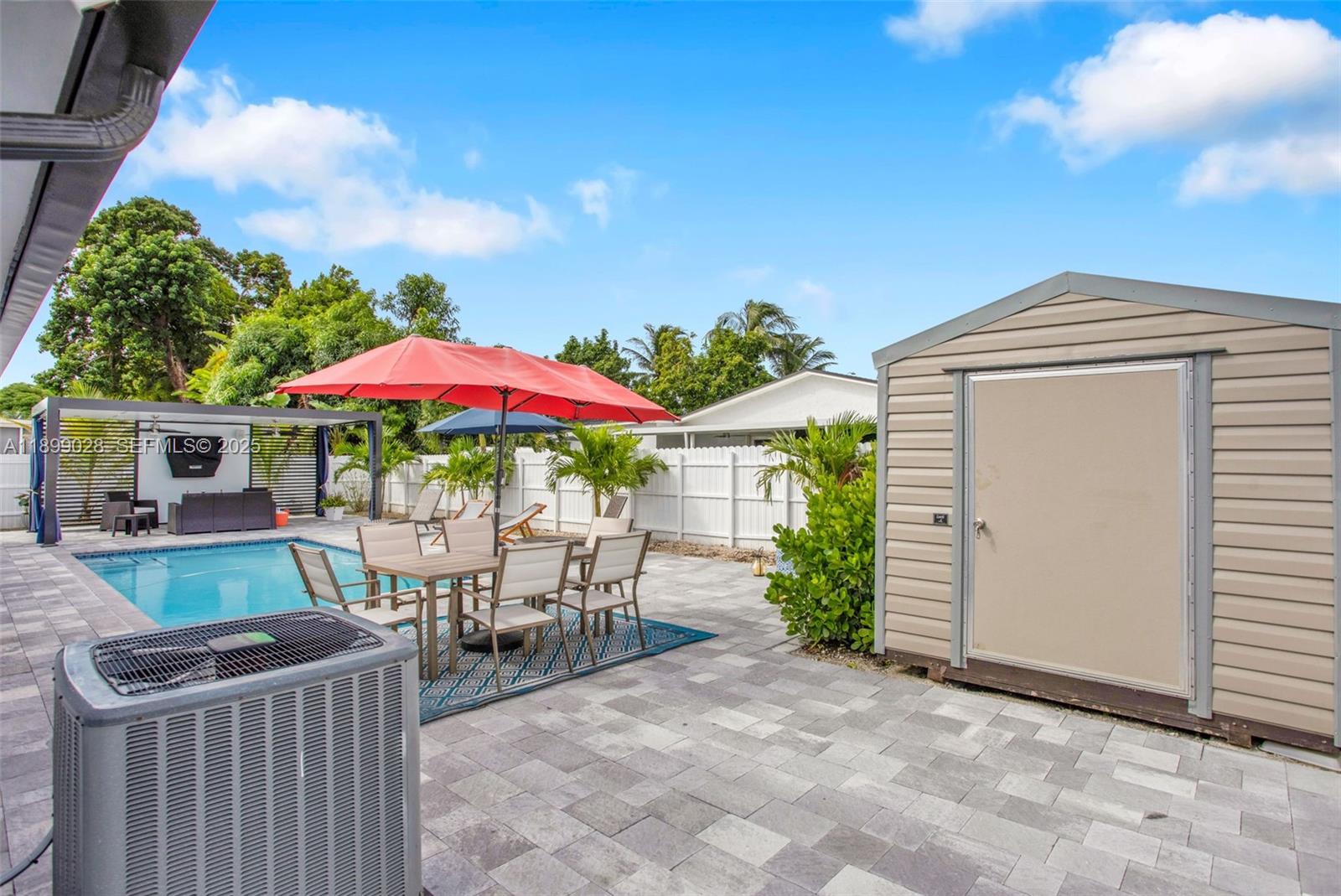 16922 Southwest 107th Place Miami, FL 33157 - Photo 7 of 45 a view of a house with backyard and sitting area