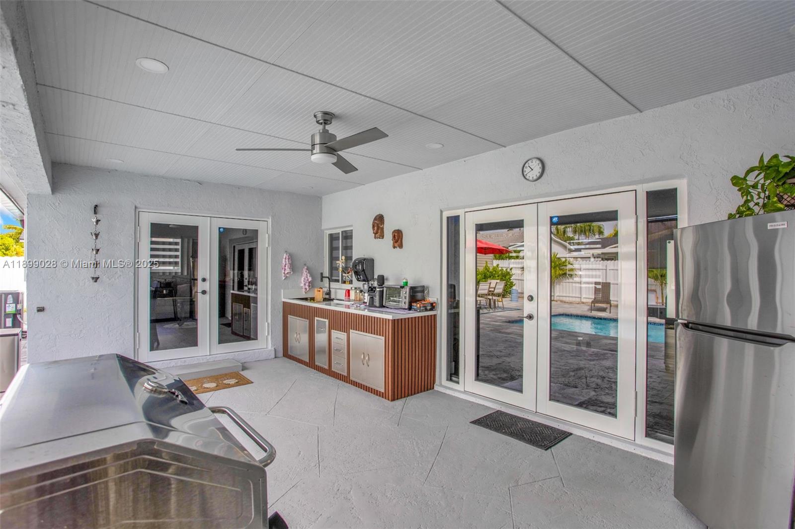 16922 Southwest 107th Place Miami, FL 33157 - Photo 9 of 45 a living room with furniture and a window