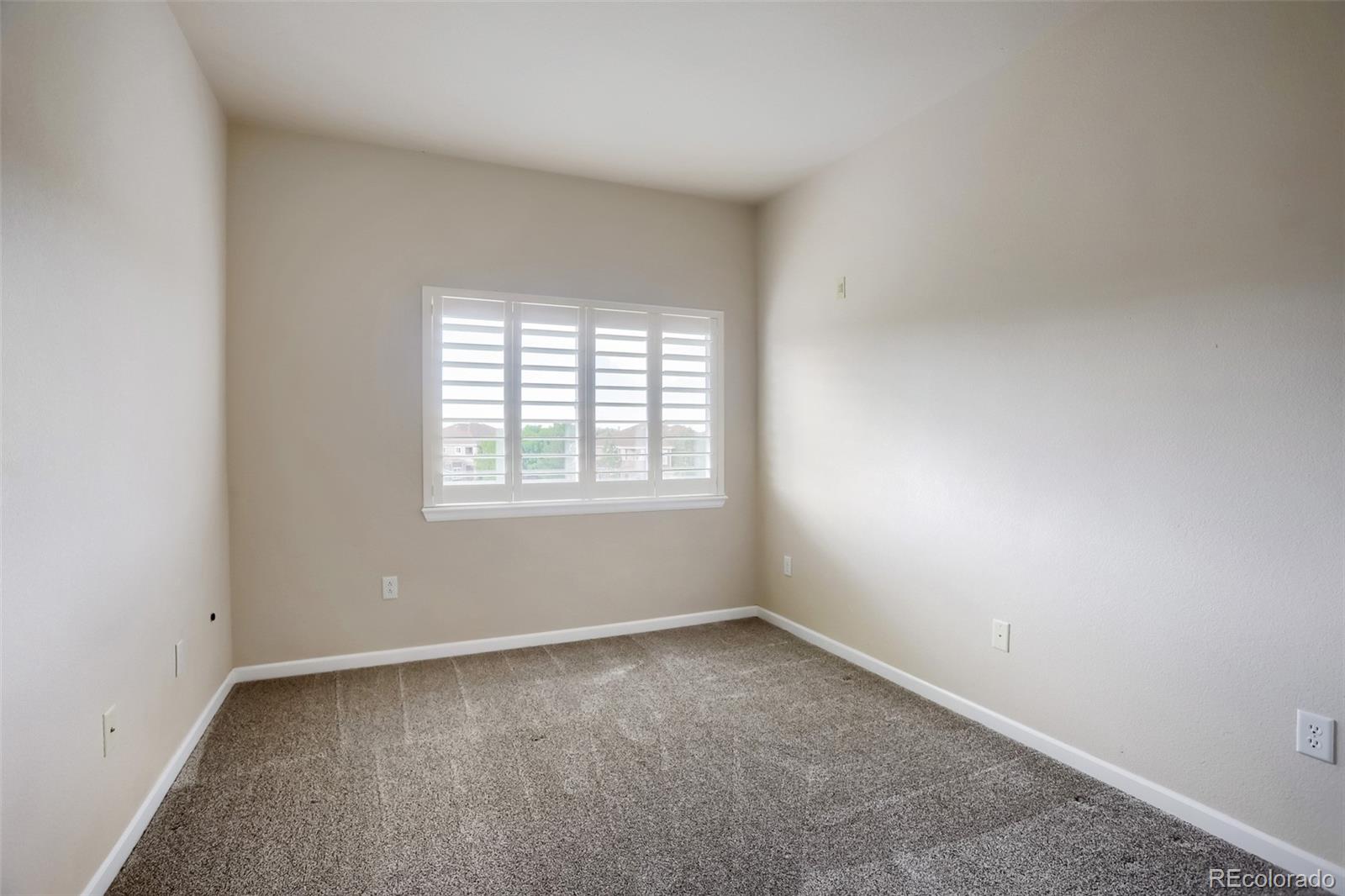6232 Kilmer Loop, Unit 203 Golden, CO 80403 - Photo 24 of 33 an empty room with a window