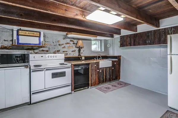 a kitchen with a stove and a sink