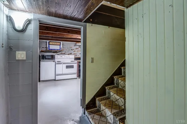 a kitchen with a stove and a refrigerator